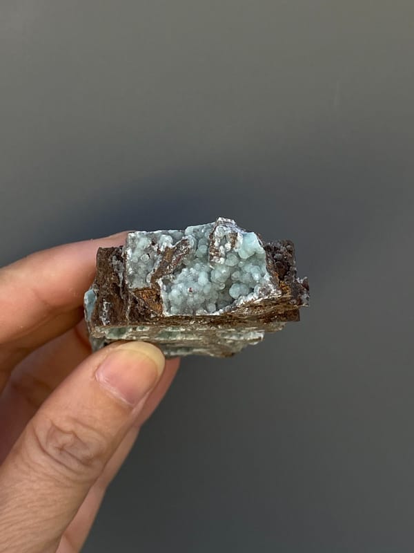 Pale blue-green hemimorphite lining an open skeletal rock, Yunnan, China, top view