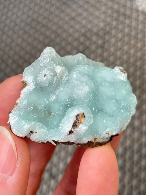 Pale mint-green botryoidal hemimorphite crust from Yunnan, China, close-up of the crystal faces