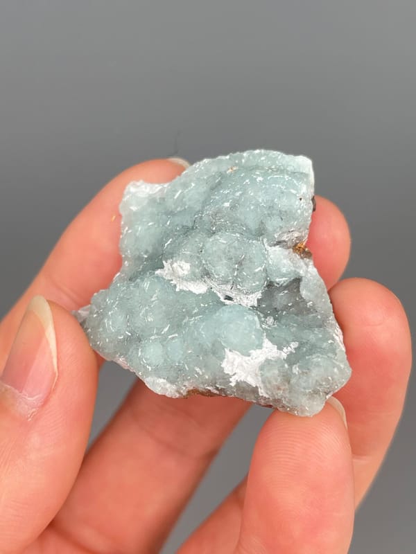 Pale mint-green botryoidal hemimorphite crust from Yunnan, China, close-up of the crystal faces
