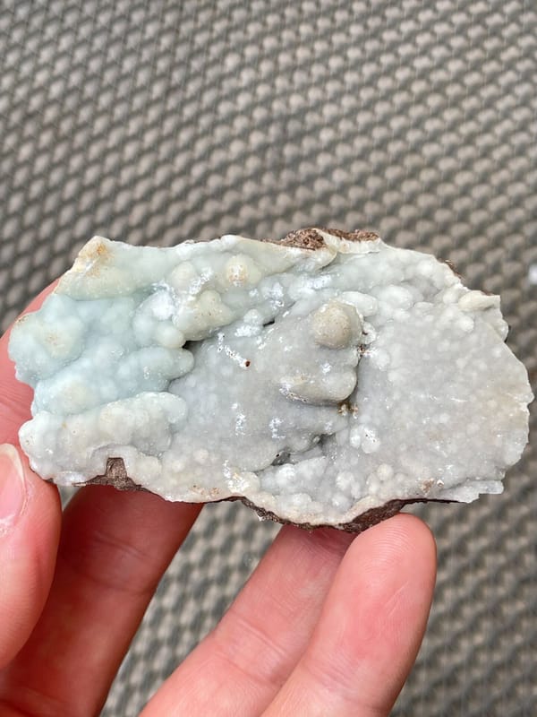 Pale blue-green botryoidal hemimorphite plate from Yunnan, China