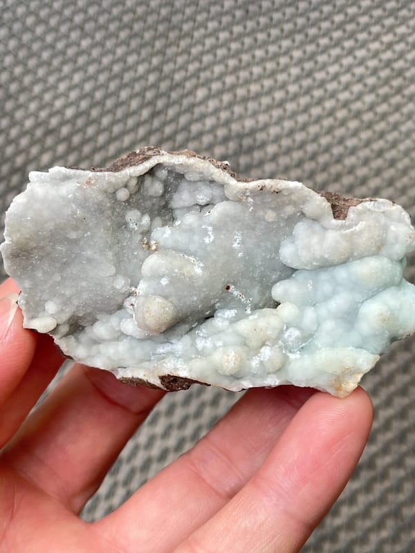 Pale blue-green botryoidal hemimorphite plate from Yunnan, China, close-up of the crystal faces