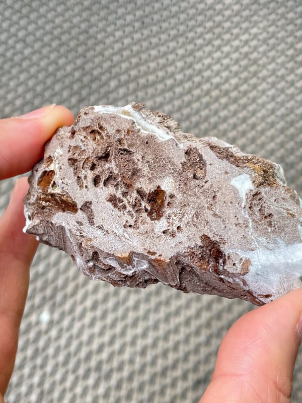 Pale blue-green botryoidal hemimorphite plate from Yunnan, China, detail of the matrix contact