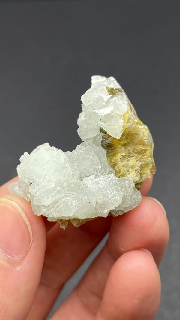 White botryoidal prehnite with yellow-green clinozoisite blades from Peru