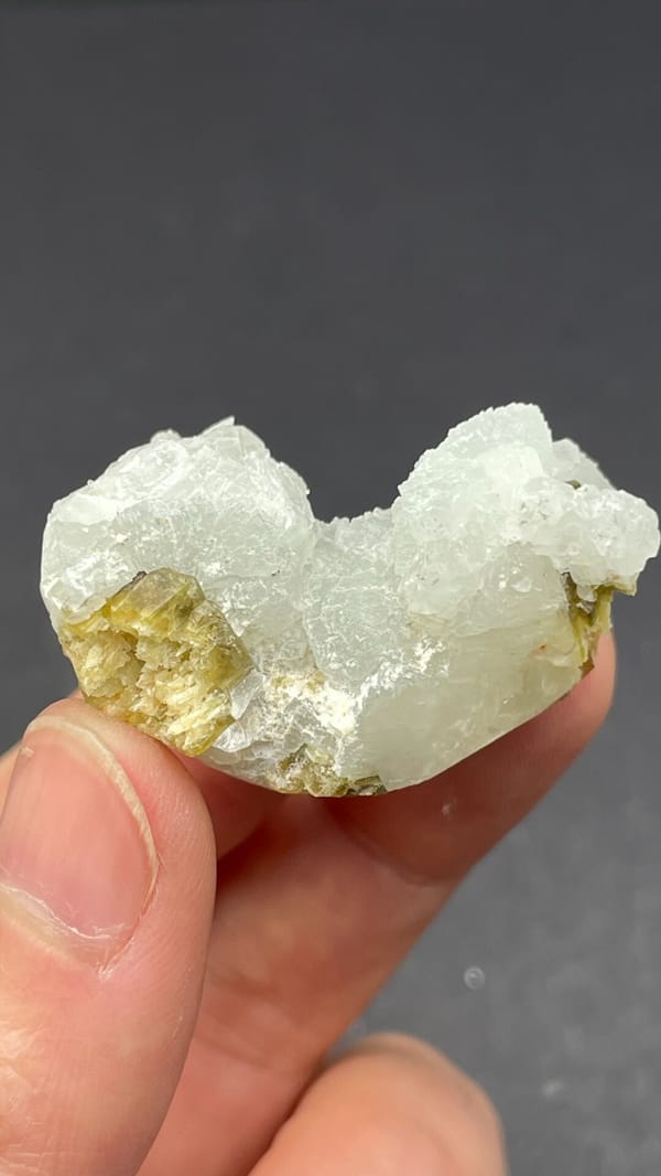 White botryoidal prehnite with yellow-green clinozoisite blades from Peru, reverse side