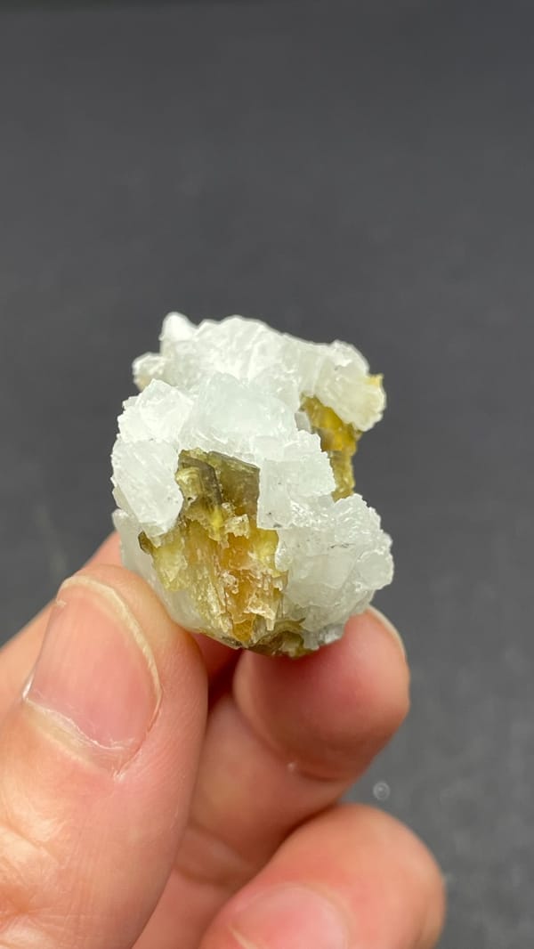 White botryoidal prehnite with yellow-green clinozoisite blades from Peru, top view