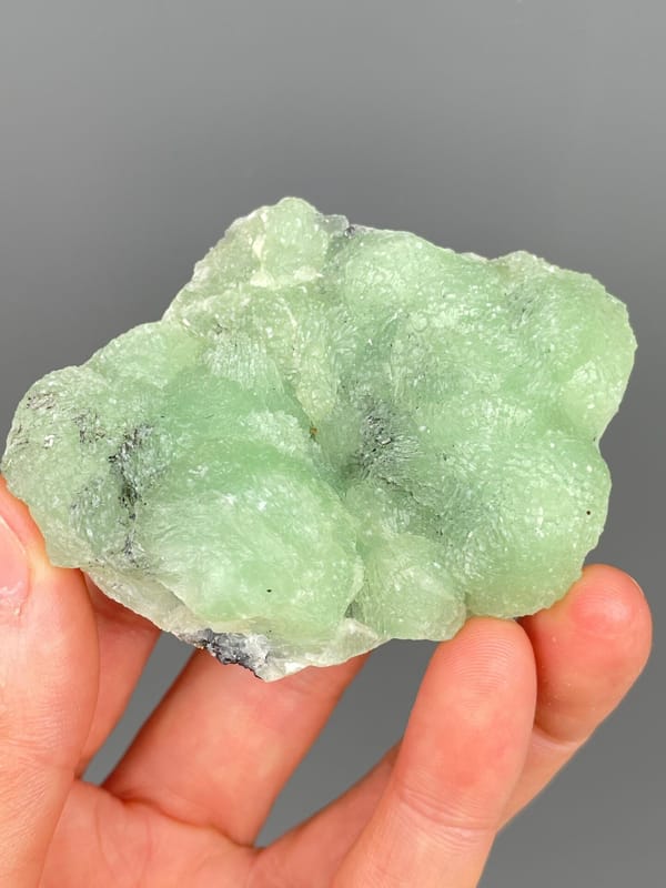 Apple-green botryoidal prehnite plate from Sichuan, China, reverse side