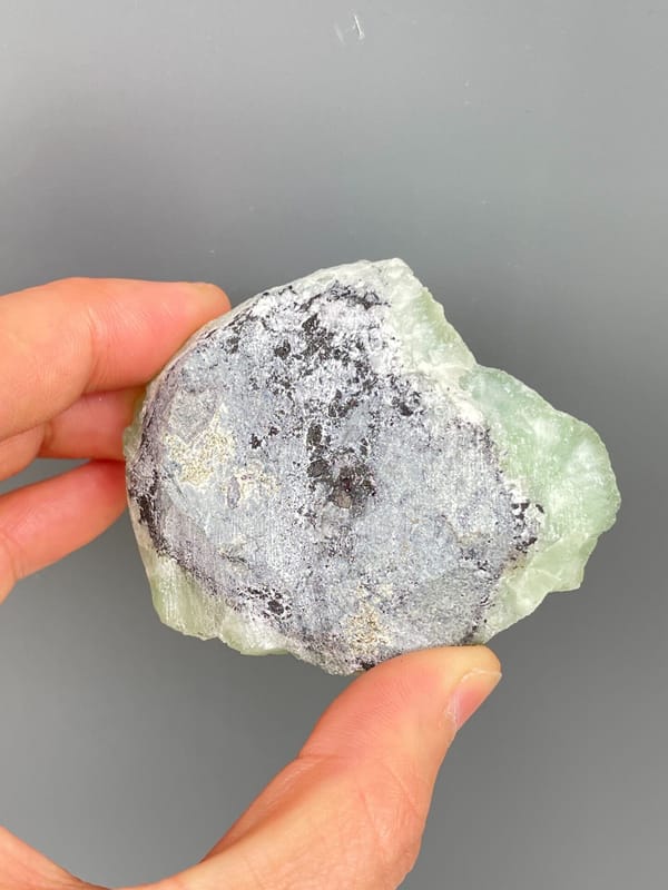 Apple-green botryoidal prehnite plate from Sichuan, China, side view