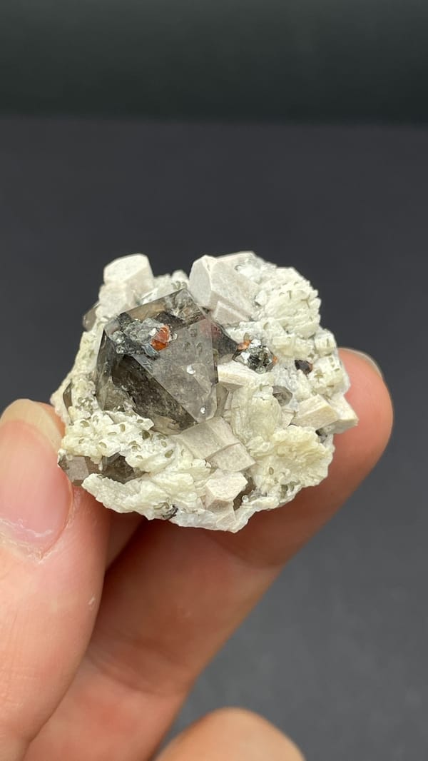 Smoky quartz crystal in cream feldspar from Yunxiao, Fujian, China, reverse side