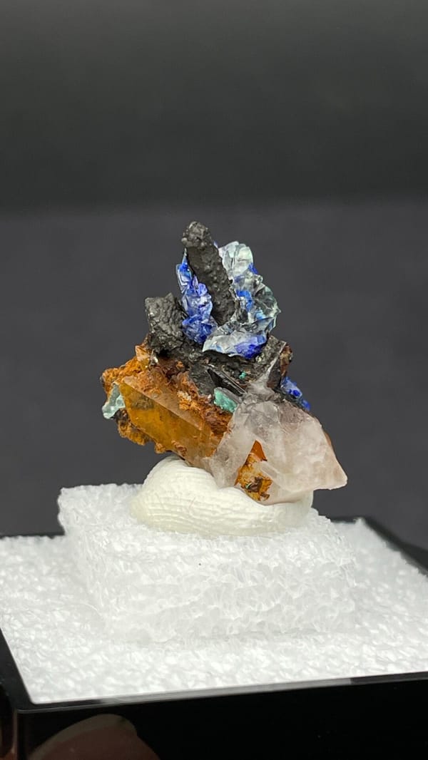 Electric blue azurite with green malachite on limonite from Morocco, in a box, reverse side