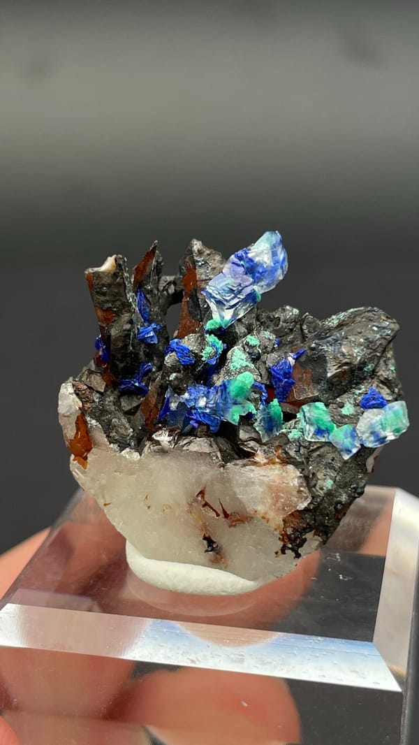 Blue azurite and green malachite on a white quartz base from Morocco, close-up of the crystal faces