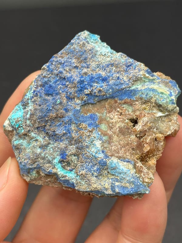 Deep blue azurite crust spread across a rock slab from Yunnan, China, top view