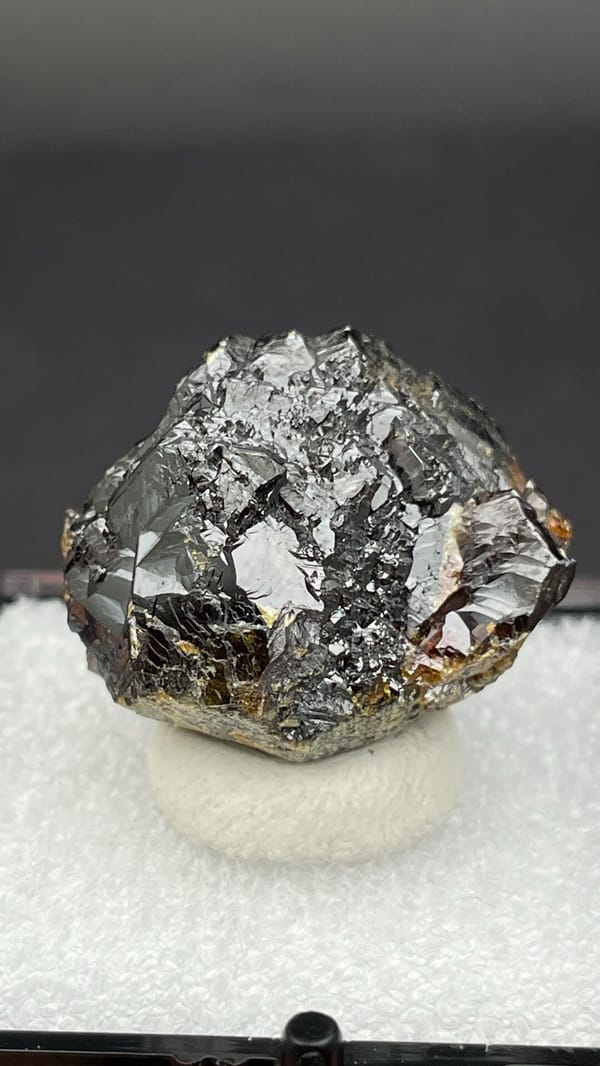 Dark brown Tennessee sphalerite crystal group from the USA, in a display box