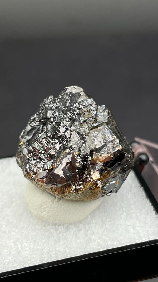 Dark brown Tennessee sphalerite crystal group from the USA, in a display box, second angle