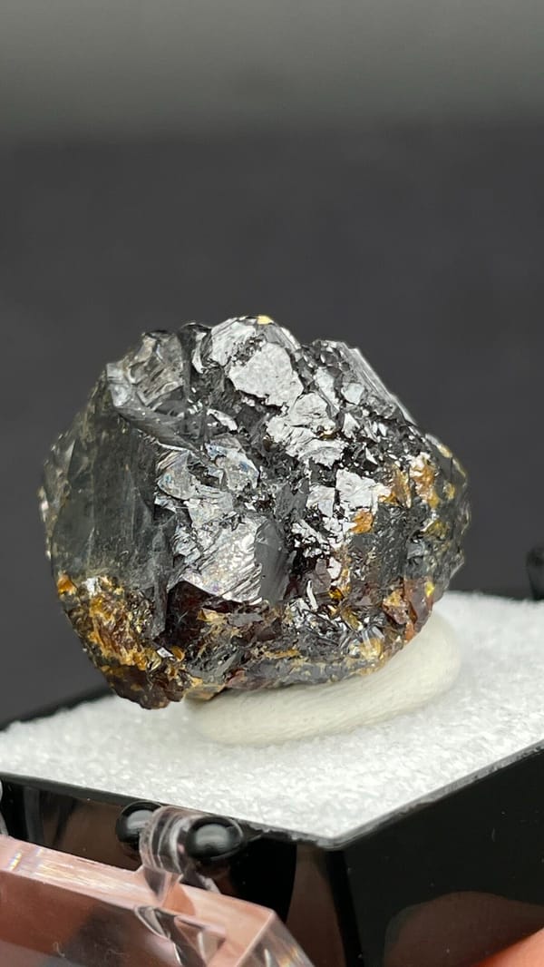 Dark brown Tennessee sphalerite crystal group from the USA, in a display box, reverse side