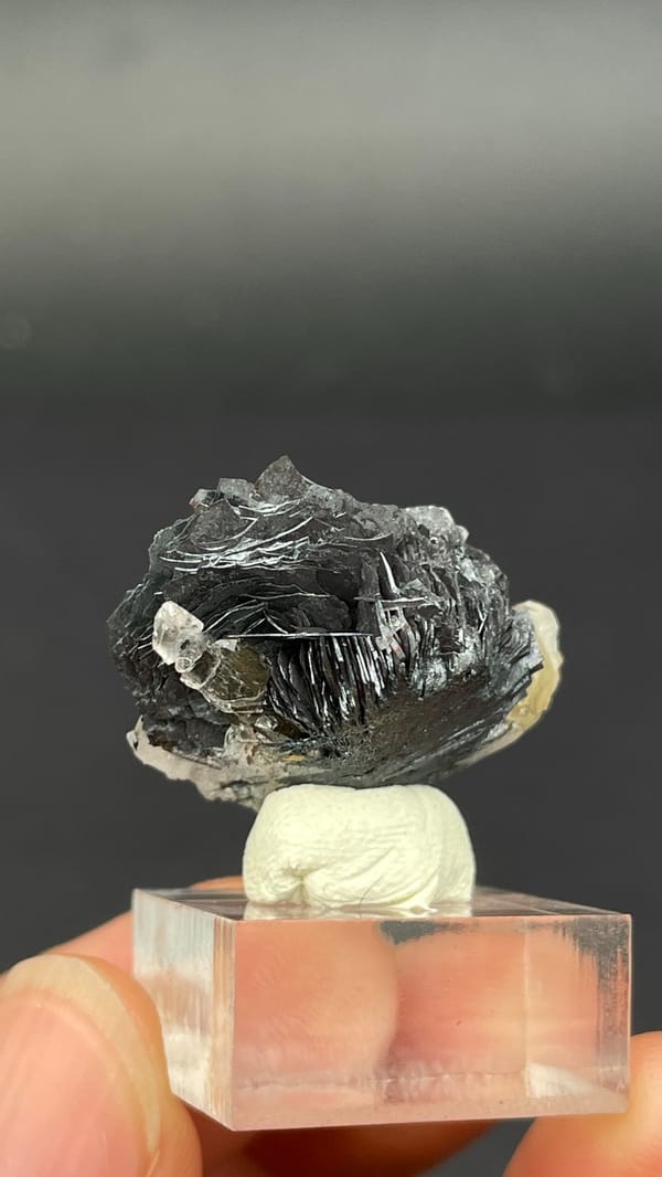 Dark metallic specular hematite flower from Jinlong, Guangdong, China, close-up of the crystal faces