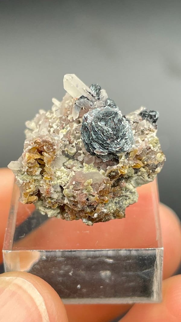 Dark metallic specular hematite rosette on matrix, Inner Mongolia, China