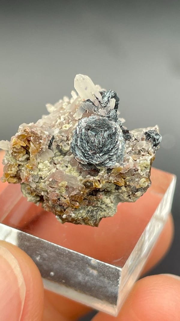 Dark metallic specular hematite rosette on matrix, Inner Mongolia, China, second angle