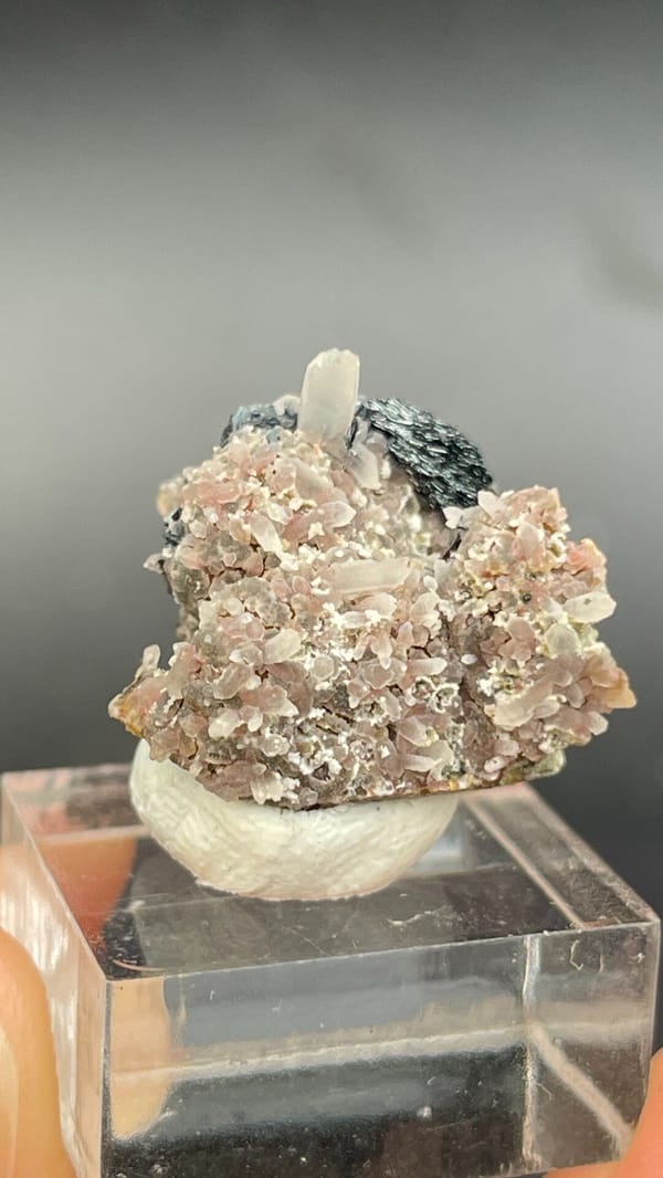 Dark metallic specular hematite rosette on matrix, Inner Mongolia, China, reverse side