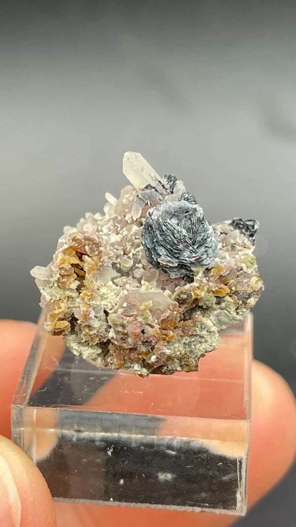 Dark metallic specular hematite rosette on matrix, Inner Mongolia, China, top view
