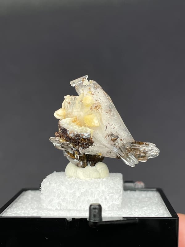 Colourless bladed creedite crystals with dark inclusions from Guizhou, China