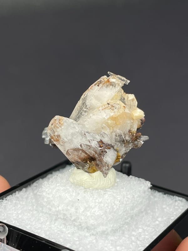 Colourless bladed creedite crystals with dark inclusions from Guizhou, China, top view