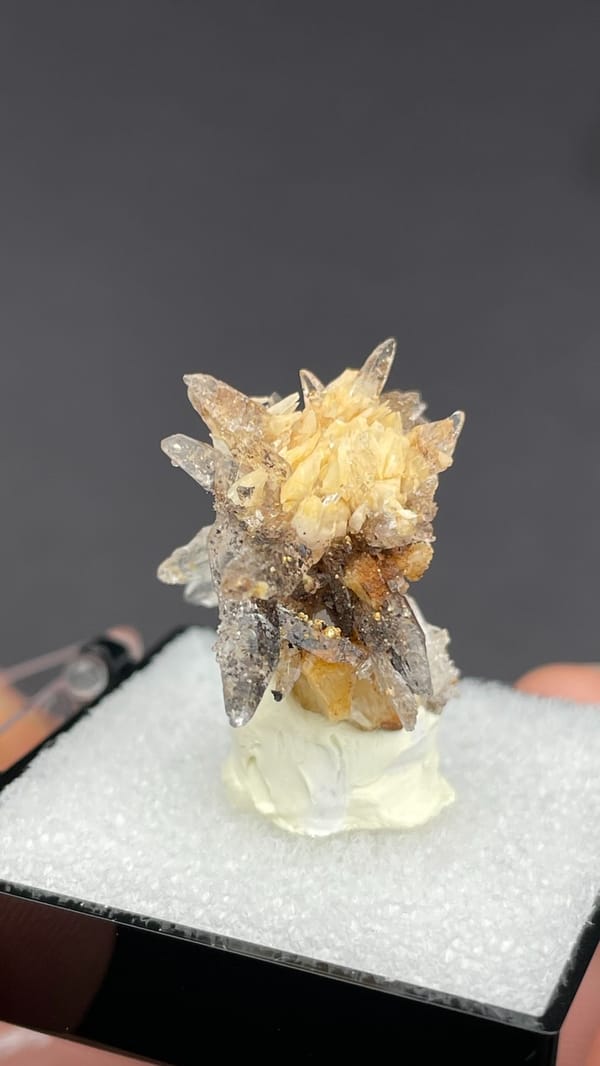Colourless creedite and gypsum crystals radiating around a rock core, Guizhou, China, second angle