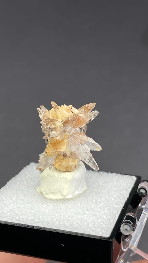 Colourless creedite and gypsum crystals radiating around a rock core, Guizhou, China, reverse side