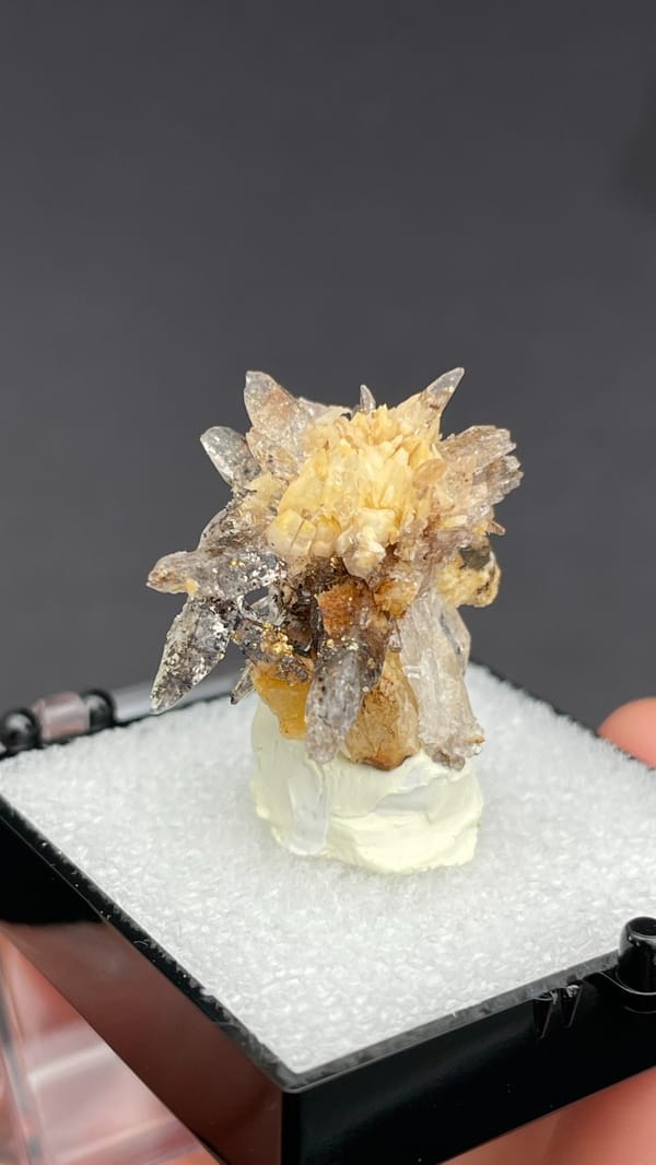 Colourless creedite and gypsum crystals radiating around a rock core, Guizhou, China, top view