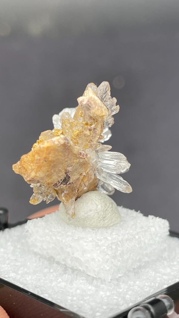 Colourless creedite and gypsum crystal flower from Guizhou, China, in a box, top view