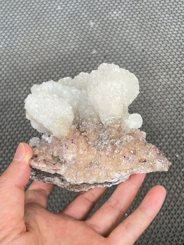 Large white creedite crystal crust on pale base from Guizhou, China
