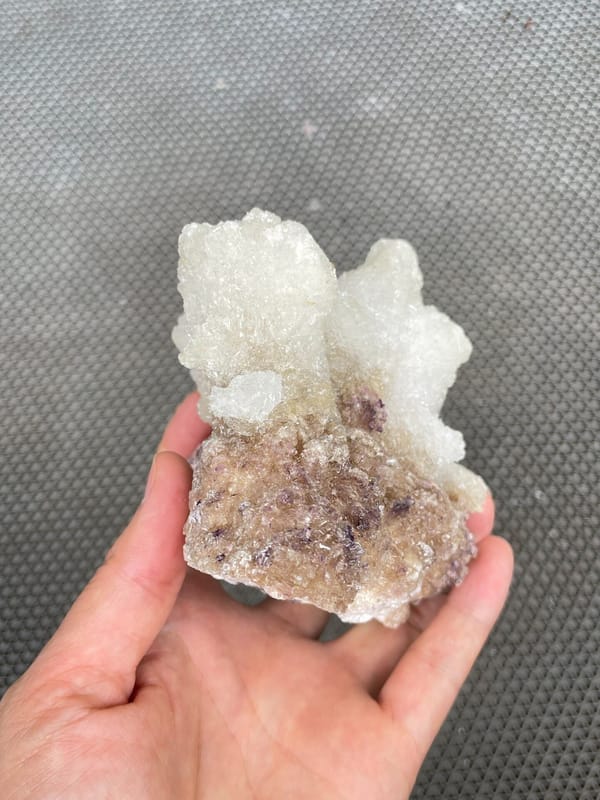 Large white creedite crystal crust on pale base from Guizhou, China, second angle