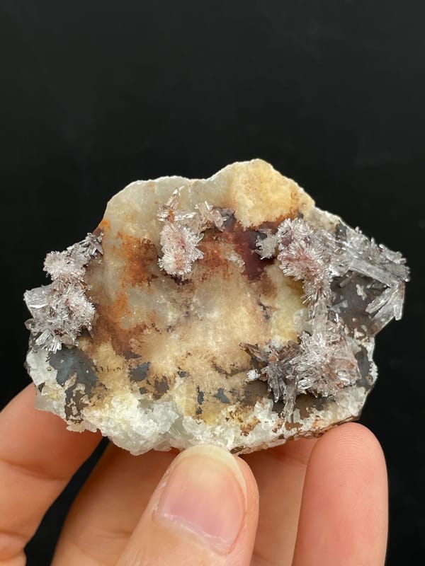 Cream creedite crust with rust-orange staining from Guizhou, China