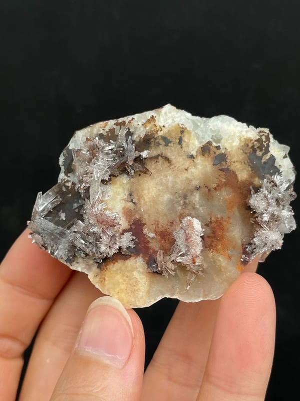 Cream creedite crust with rust-orange staining from Guizhou, China, top view