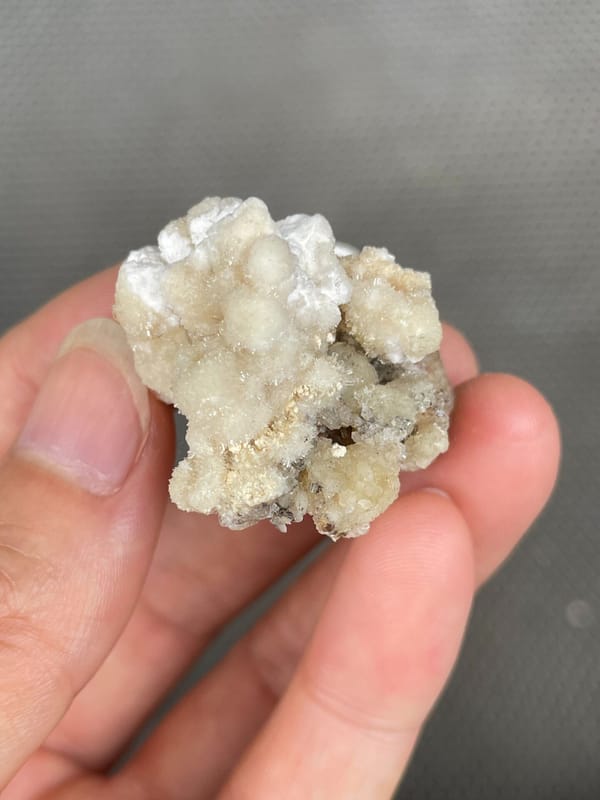 Cream popcorn-textured creedite crust from Guizhou, China, second angle