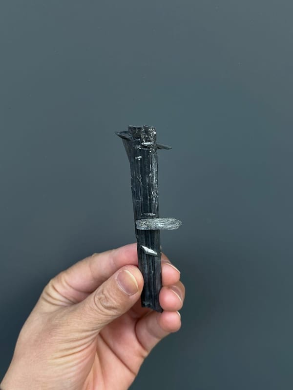 Long silver-grey striated stibnite blade from Yunnan, China, second angle