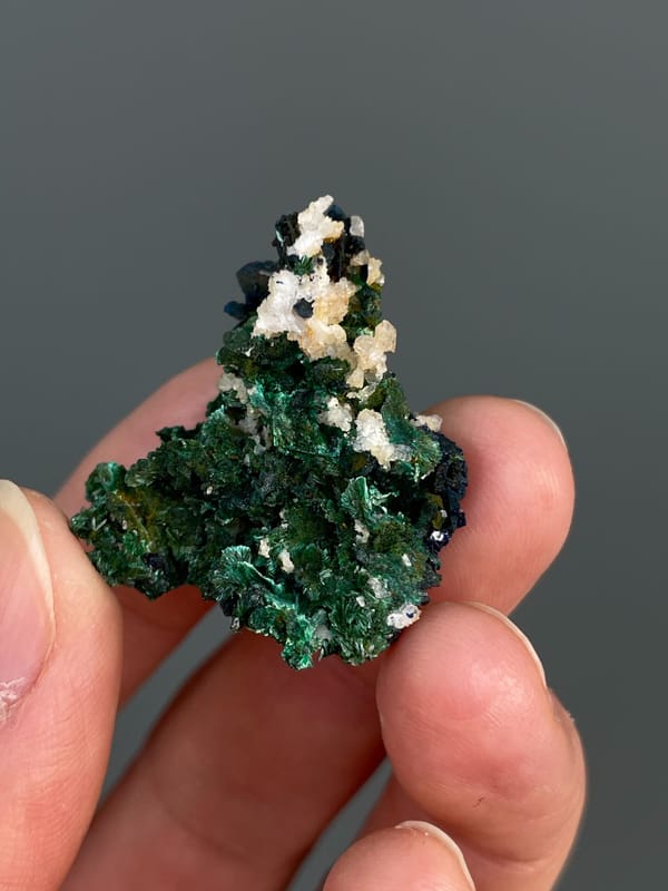 Deep green malachite with white crystals on top from Anhui, China, second angle