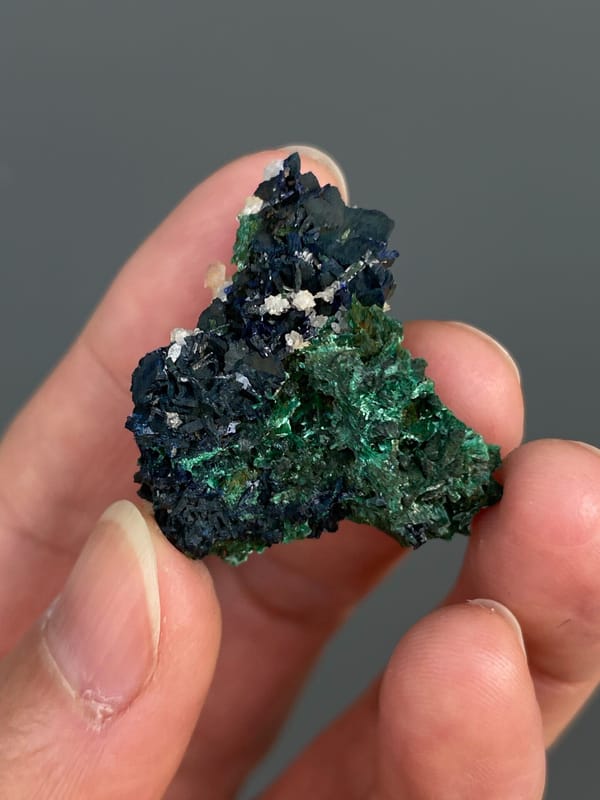 Deep green malachite with white crystals on top from Anhui, China, top view