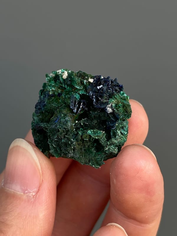 Deep blue azurite crystals in green malachite from Anhui, China, second angle