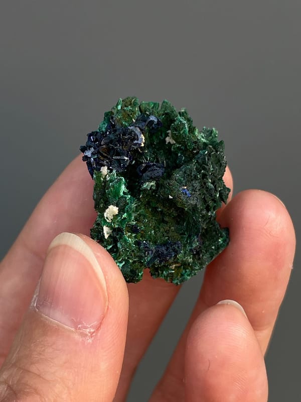 Deep blue azurite crystals in green malachite from Anhui, China, reverse side