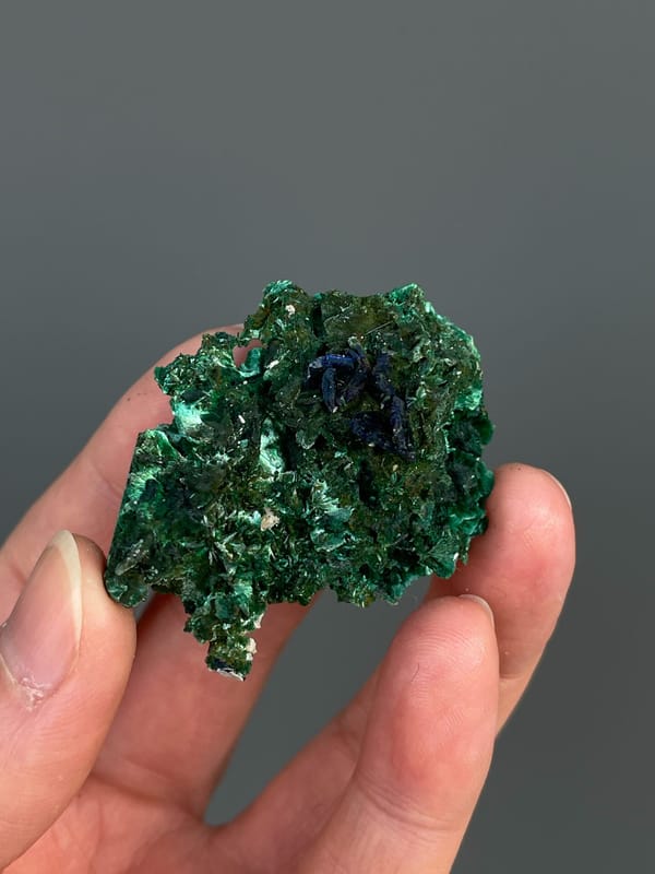 Green malachite crust with dark blue azurite patches from Anhui, China, reverse side