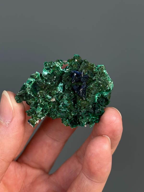 Green malachite crust with dark blue azurite patches from Anhui, China, top view