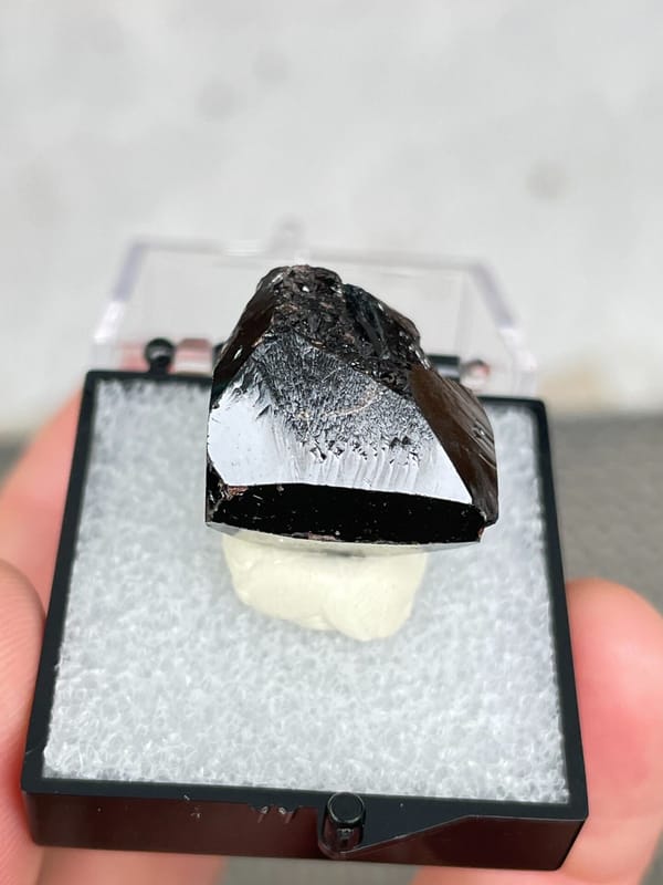Glassy black cassiterite single crystal from Xuebaoding, Sichuan, China, second angle
