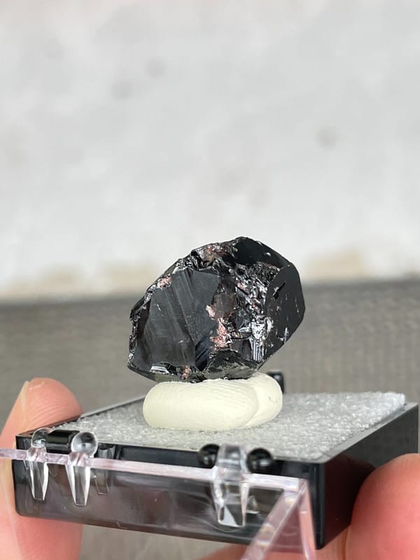 Glassy black cassiterite single crystal from Xuebaoding, Sichuan, China, top view