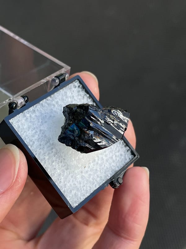 Wedge-shaped black cassiterite crystal from Xuebaoding, Sichuan, China, reverse side
