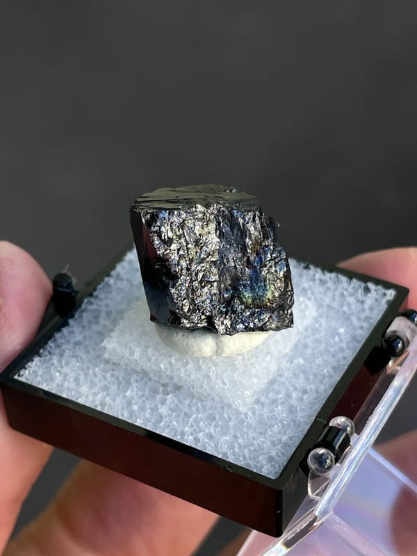 Wedge-shaped black cassiterite crystal from Xuebaoding, Sichuan, China, top view