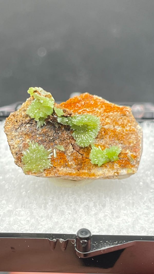 Apple-green pyromorphite tufts on an orange matrix slab from Guangxi, China