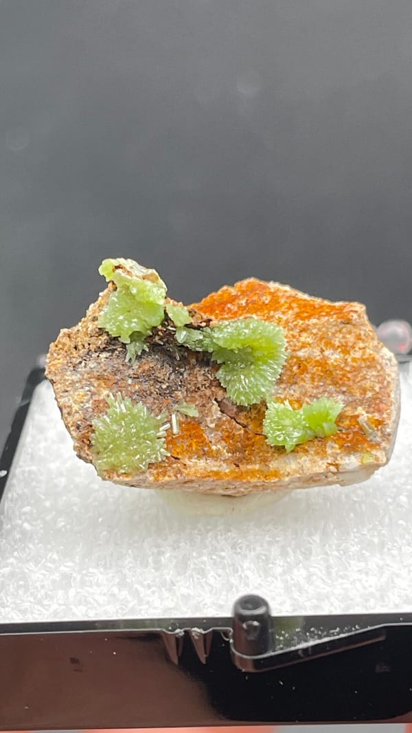 Apple-green pyromorphite tufts on an orange matrix slab from Guangxi, China, reverse side