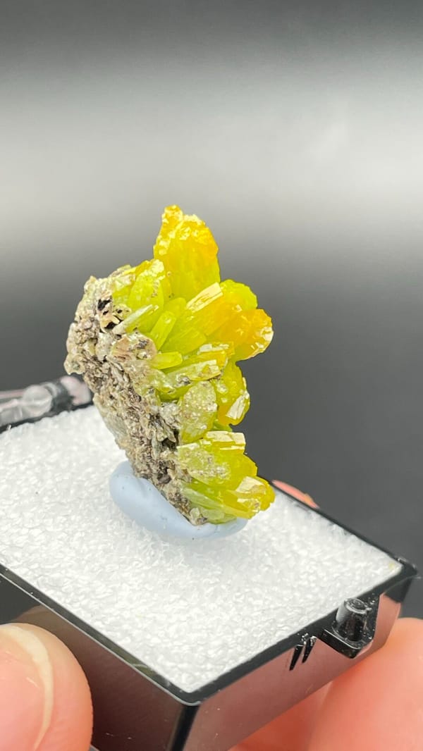 Canary-yellow stacked pyromorphite crystals from Guangdong, China, in a box, close-up of the crystal faces