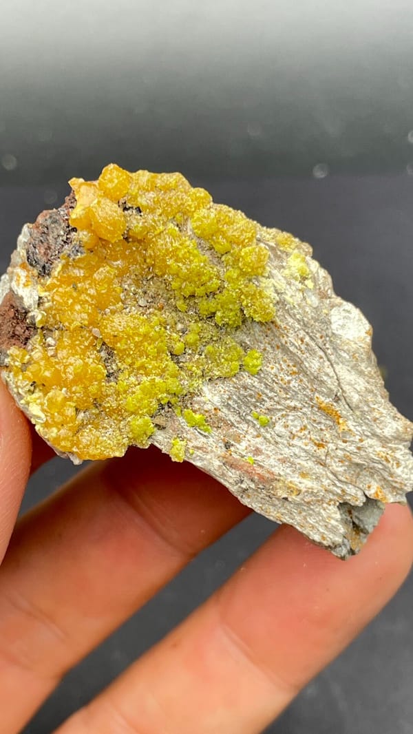 Mustard-yellow pyromorphite crust on a grey slab from Guangdong, China, top view