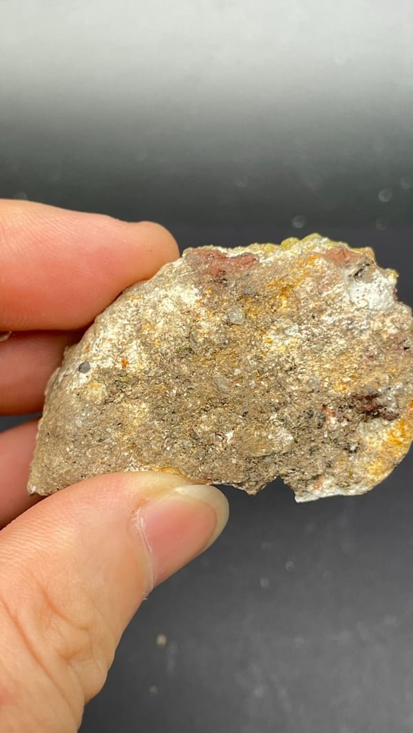 Mustard-yellow pyromorphite crust on a grey slab from Guangdong, China, detail of the matrix contact